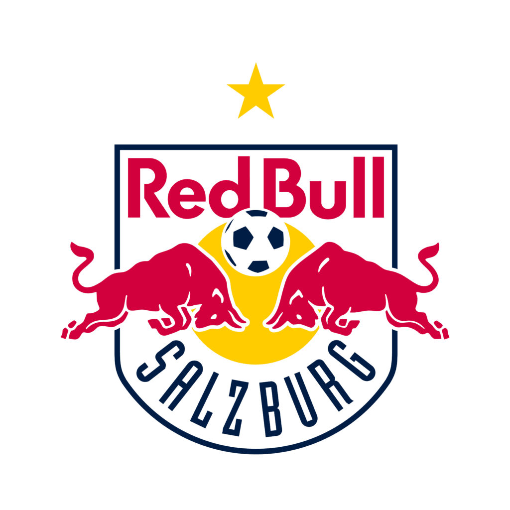 Das Logo von Red Bull Salzburg mit zwei roten Stieren, einem Fußball, einer gelben Sonne und einem goldenen Stern über dem Wappen.